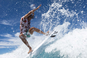 Wakesurfing cutback on a surf style wakesurf board